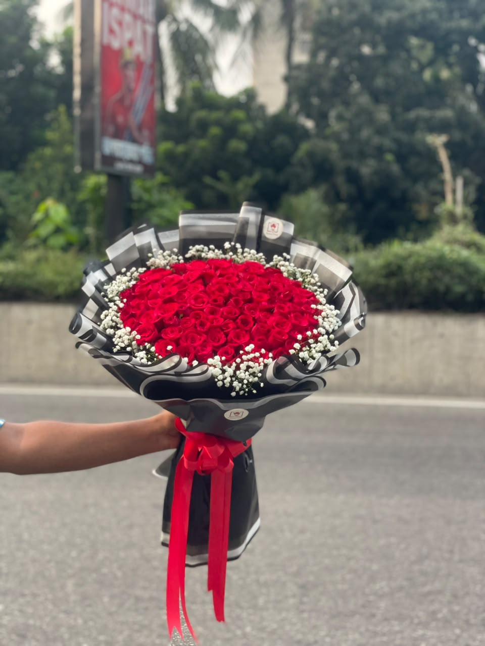 WhatsApp Image 2026-10-01 at 5.26.39 PM 100 Red Rose Bouquet (Opulent, Majestic & Luxury) - Image 1